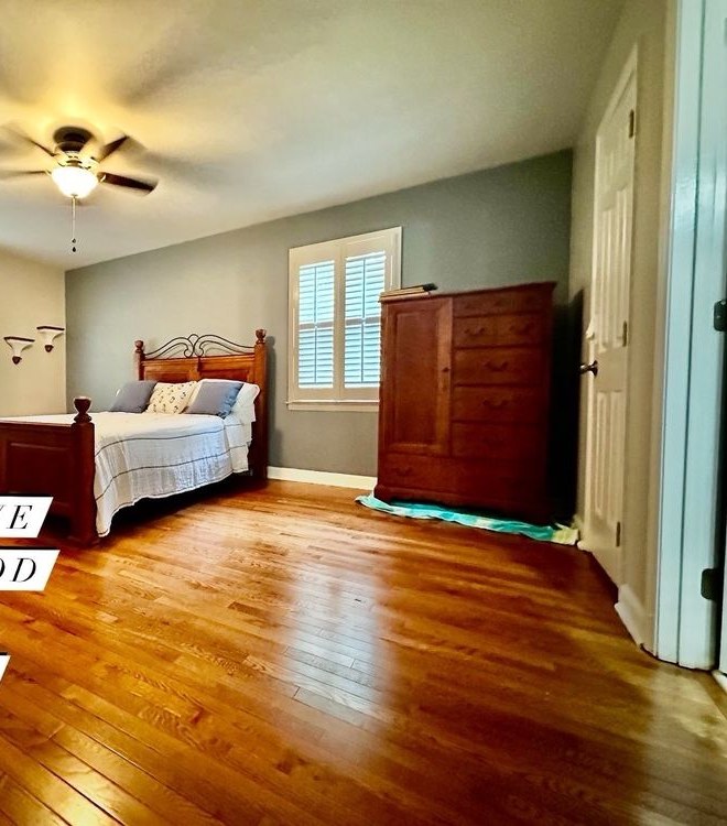 The same bedroom with newly installed red oak hardwood flooring