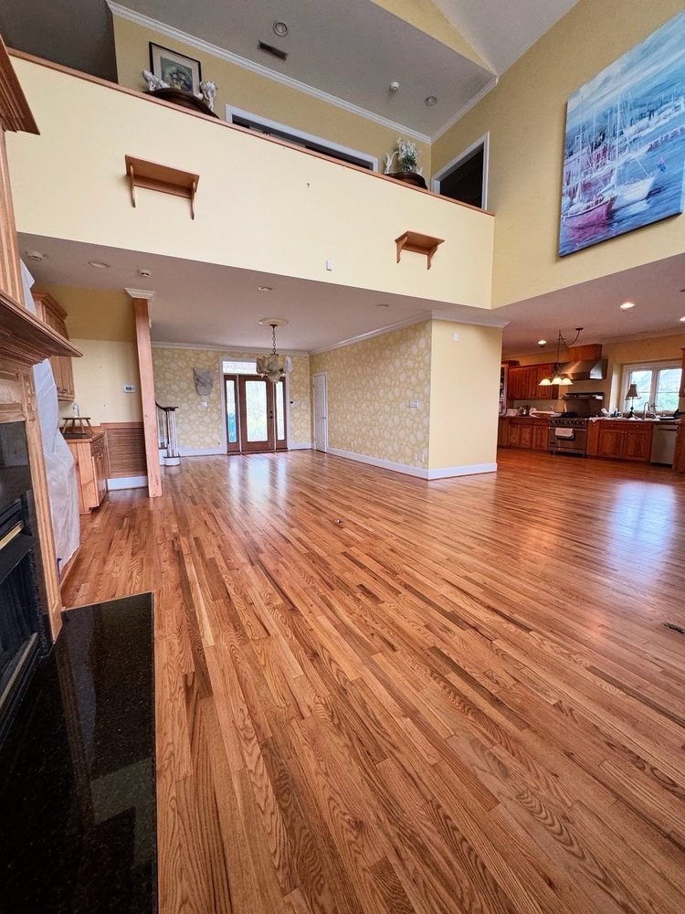Two-story great room with freshly refinished red oak flooring